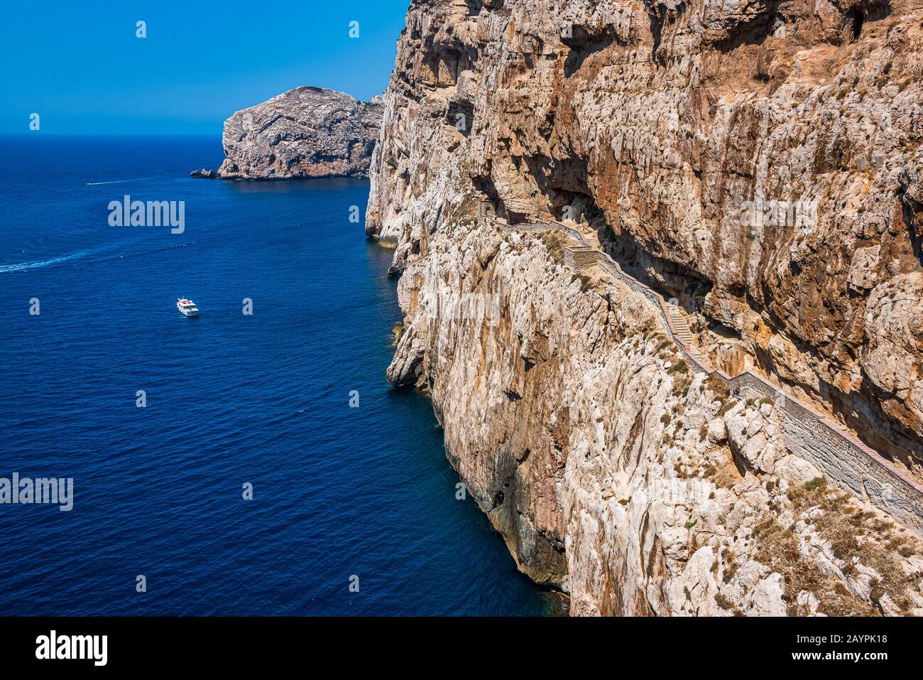 A stairway cut into the cliff in 1954, the 654-step escala del cabirol (goat's steps), leads from a car park at the top of the cliff down to the entra Stock Photo