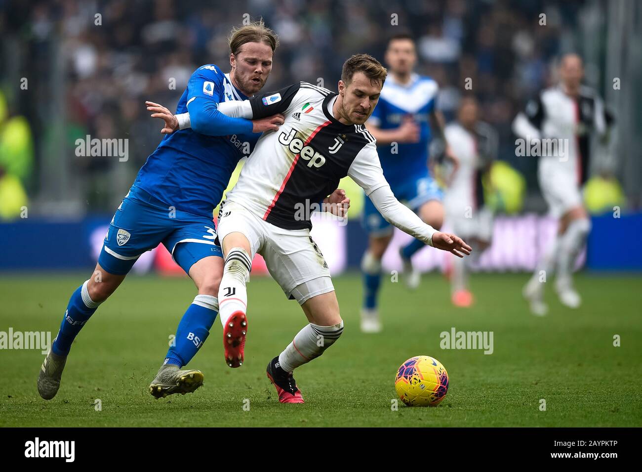 Turin, Italy - 16 February, 2020: Aaron Ramsey of Juventus FC is challenged by Birkir Bjarnason of Brescia Calcio during the Serie A football match between Juventus FC and Brescia Calcio. Credit: Nicolò Campo/Alamy Live News Stock Photo