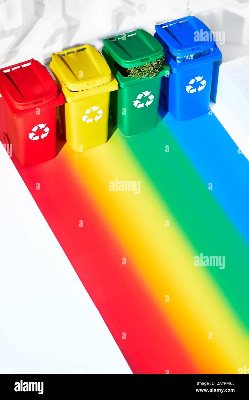 Four color coded recycle bins, isometric projection on geometric