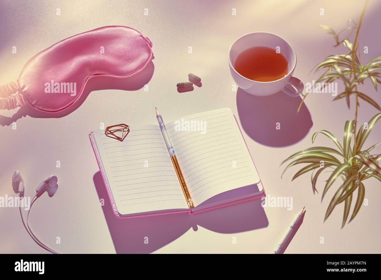 Healthy night sleep creative concept in pink and green. Sleep mask