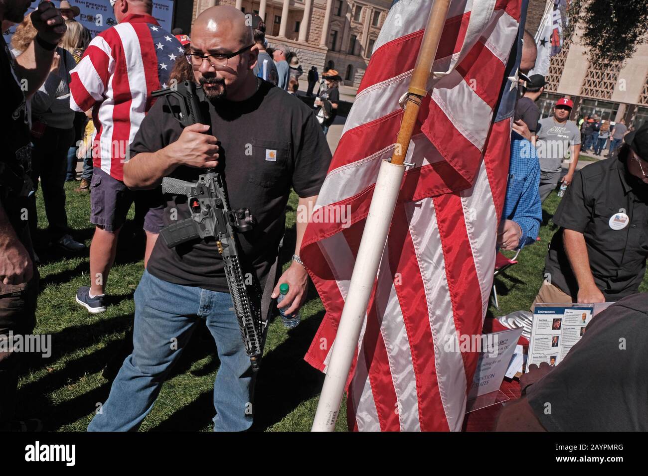 Phoenix, Arizona, USA. 15th Feb, 2020. About 1500 gun rights supporters gather at the Arizona State Capitol in support of the 2nd Ammendment. The rally was called ' Celebrate and Protect the 2nd Ammendment''. Arizona is an open carry state and advocates carry various types of long rifles to show their opposition to any proposed ban on assault weapons. They also are against so called Red Flag laws which allow police to temporarily take away guns from an individual they deam to be a threat against themselves or society. Most show support of President Trump and his strong support for any ch Stock Photo