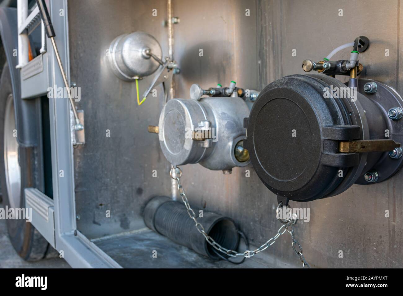 Nozzle for loading and unloading a tanker truck of dangerous goods with a single compartment, mouth for gas recovery and ground wire. Stock Photo