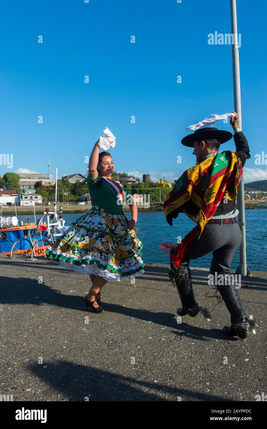 The National Champions in the Cueca dance in traditional costumes at the port of Ancud on Chiloe Island, Chile. Stock Photo