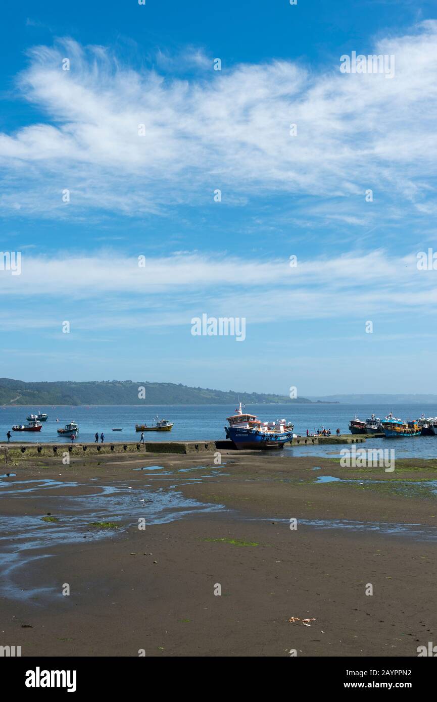 View of the jetty of Achao Village on the island of Quinchao, Chiloe Island in southern Chile at low tide. Stock Photo