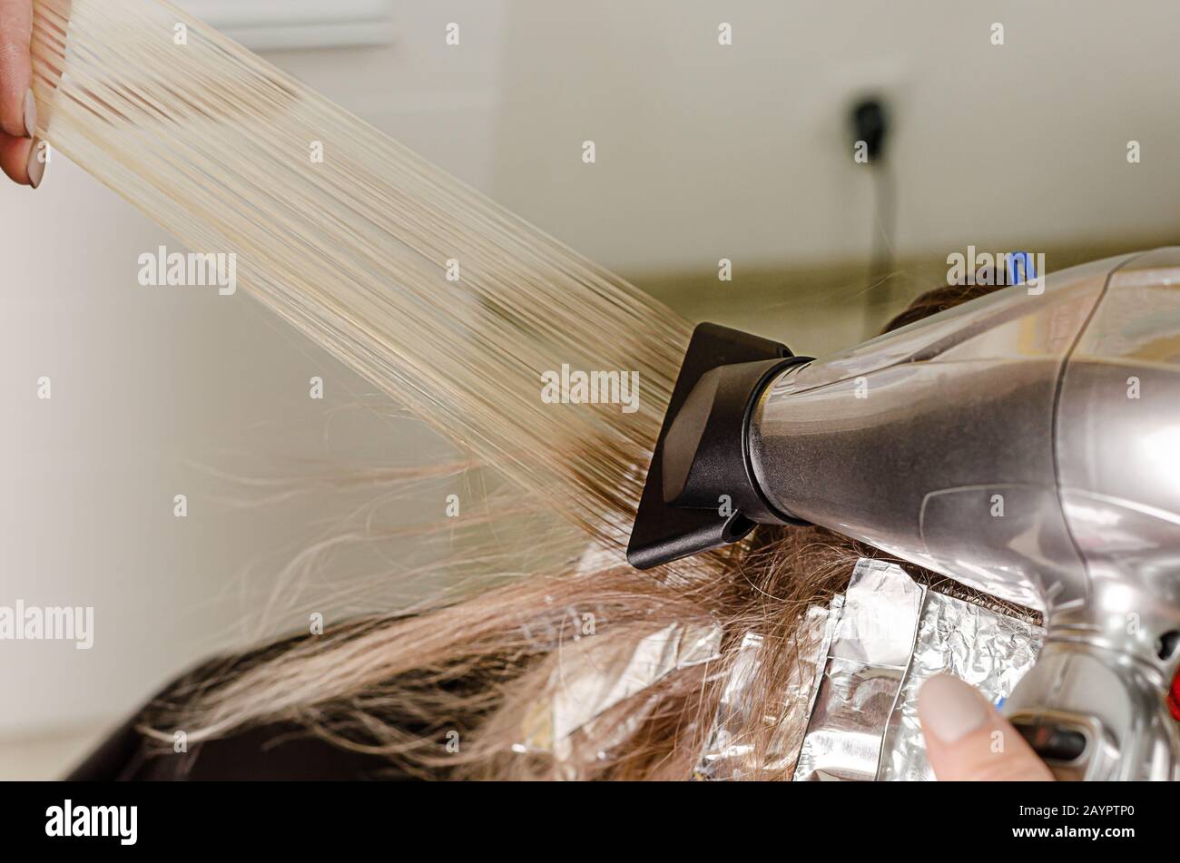 Process of applying blow dryer to blow away short hair for AirTouch