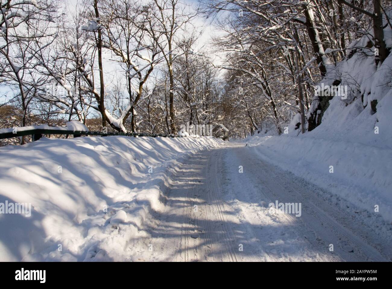 Snow covered roads in Ellicott City Maryland USA after a blizzard came through the area. The roads remained impassable even after some clearing. Stock Photo