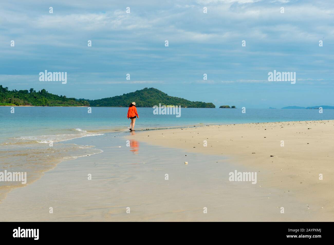 Tourist on the white sand beach of the small island of Granito de Oro in Coiba National Park in Panama. Stock Photo