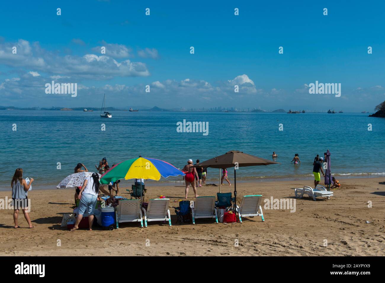 Beach scene with colorful umbrellas on the tropical island of Isla Taboga off the coast of Panama City, Panama. Stock Photo