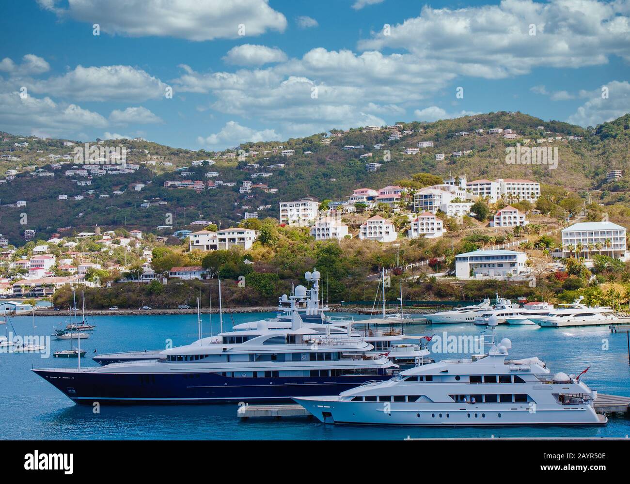 Luxury Blue and White Yachts at Caribbean Pier Stock Photo