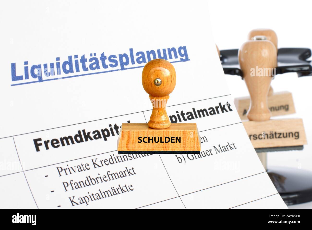 stamp lettering Schulden, credit, Germany Stock Photo