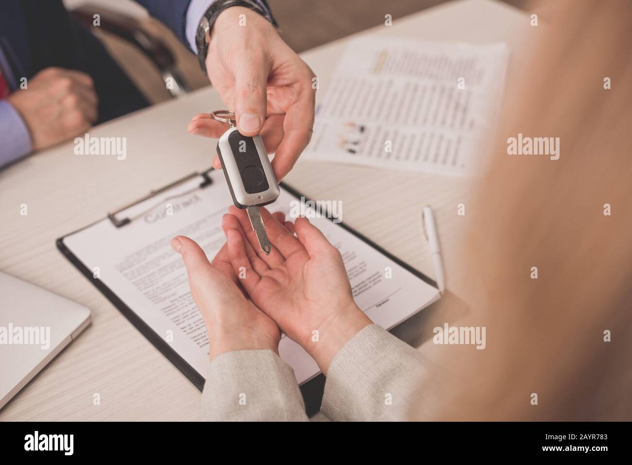 Agency giving client document car hi-res stock photography and images ...
