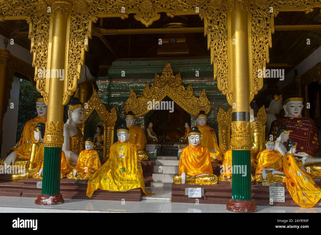 Buddha statues in one of the temples of the 2,500 years old Shwedagon Pagoda in Yangon (Rangoon), the largest city in Myanmar. Stock Photo