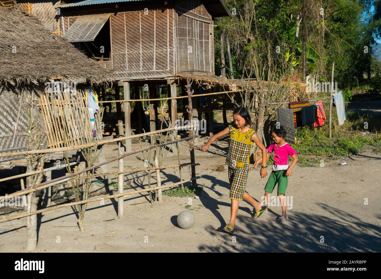 Girls are playing soccer in Naungtaw Village on Inle Lake in Myanmar. Stock Photo