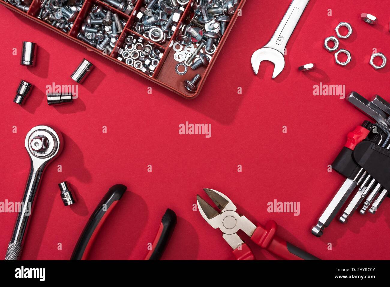 Frame of tool set with wrenches and hex keys on red background Stock ...
