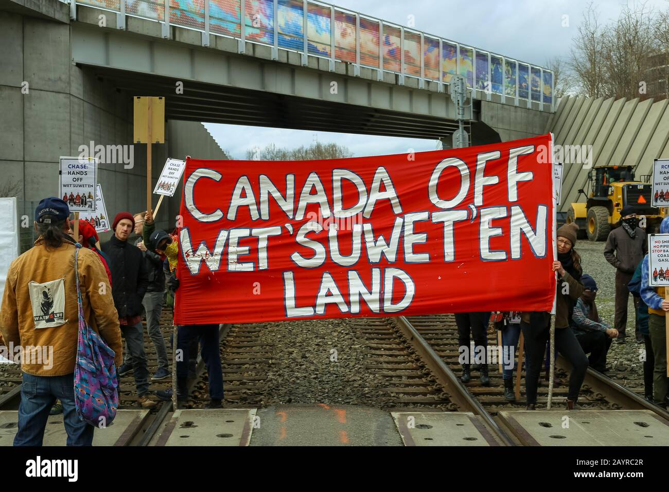 Protesters block a freight and passenger rail line through Seattle as they support the Wetʼsuwetʼen First People Stock Photo