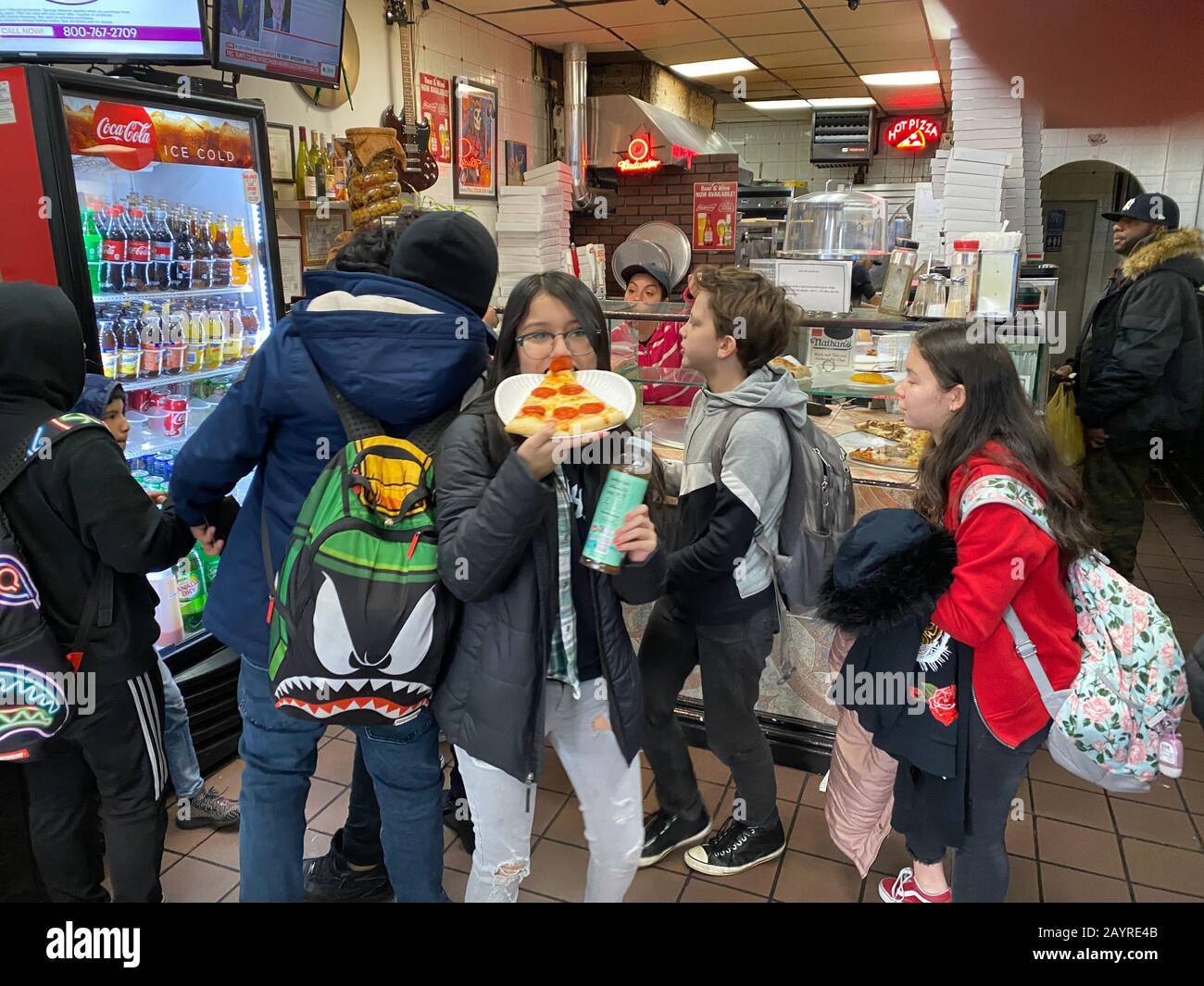 Kids at the local pizzeria after school in the Windsor Terrace neighborhood of Brooklyn, New York. Stock Photo