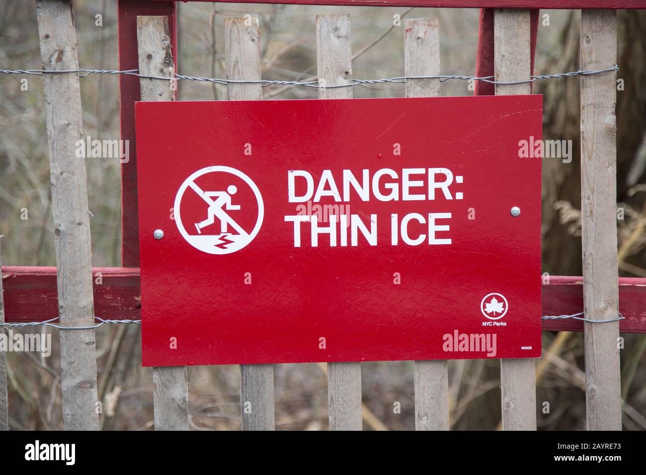 Danger! Thin Ice sign along the lake in Prospect Park, Brooklyn, New York. Stock Photo