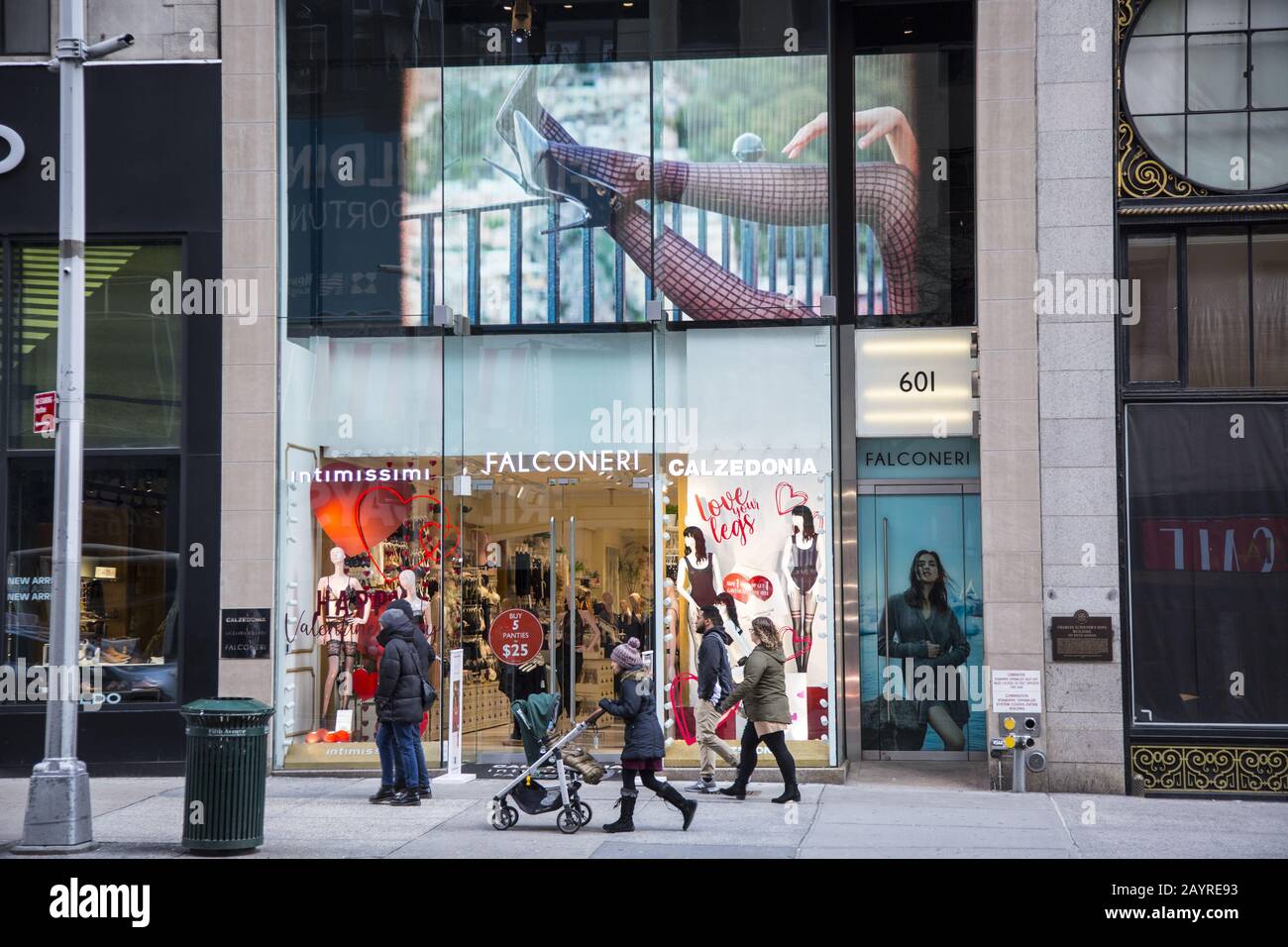 People stroll by fashion boutiques along elegant 5th Avenue in midtown  Manhattan, New York City Stock Photo - Alamy