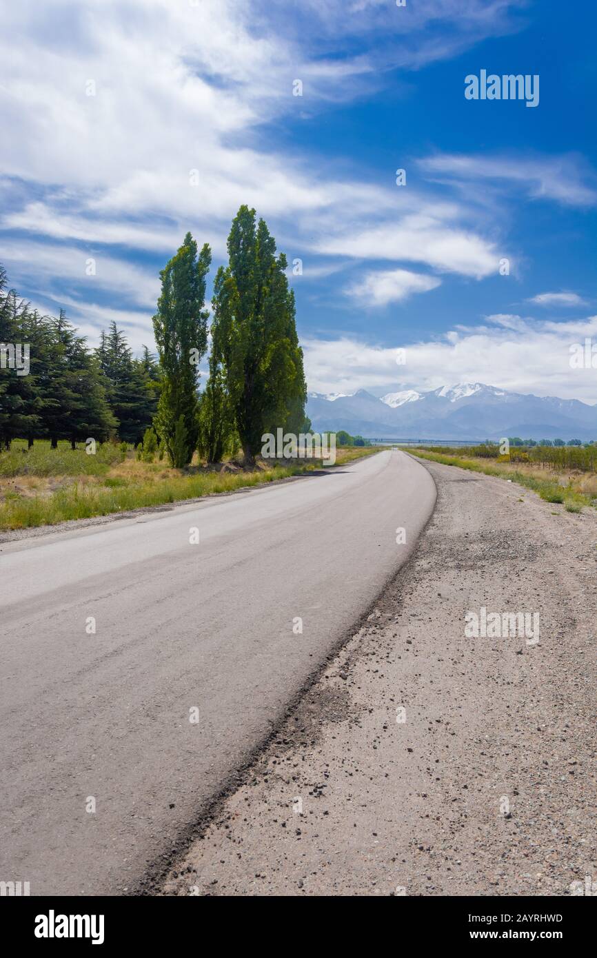 Vertical landscape of winding road with andes mountain in Uco Valley, Mendoza, Argentina Stock Photo