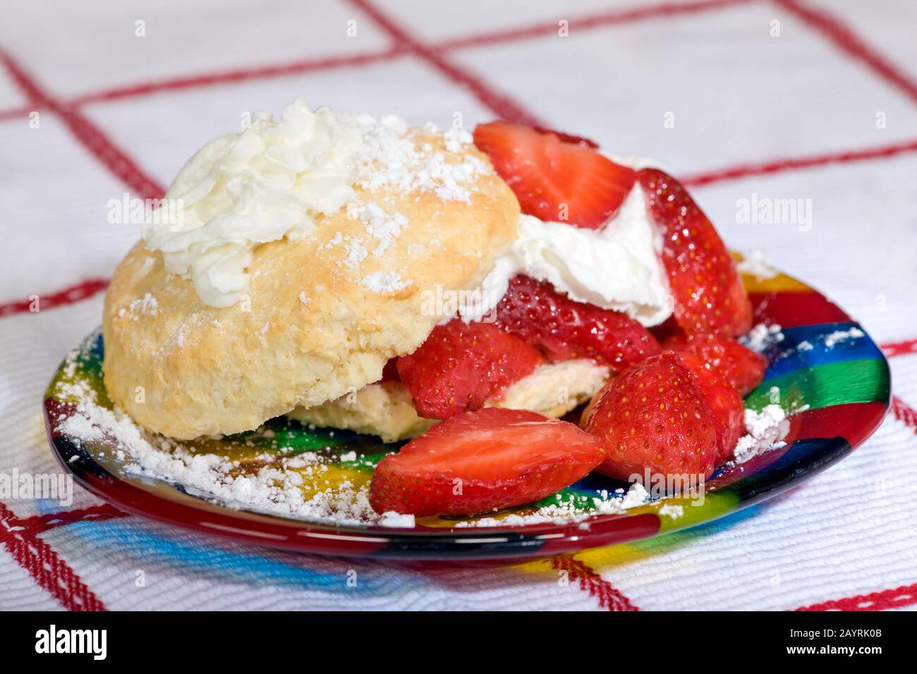 Strawberry shortcake on a plate on a checkered tablecloth Stock Photo ...