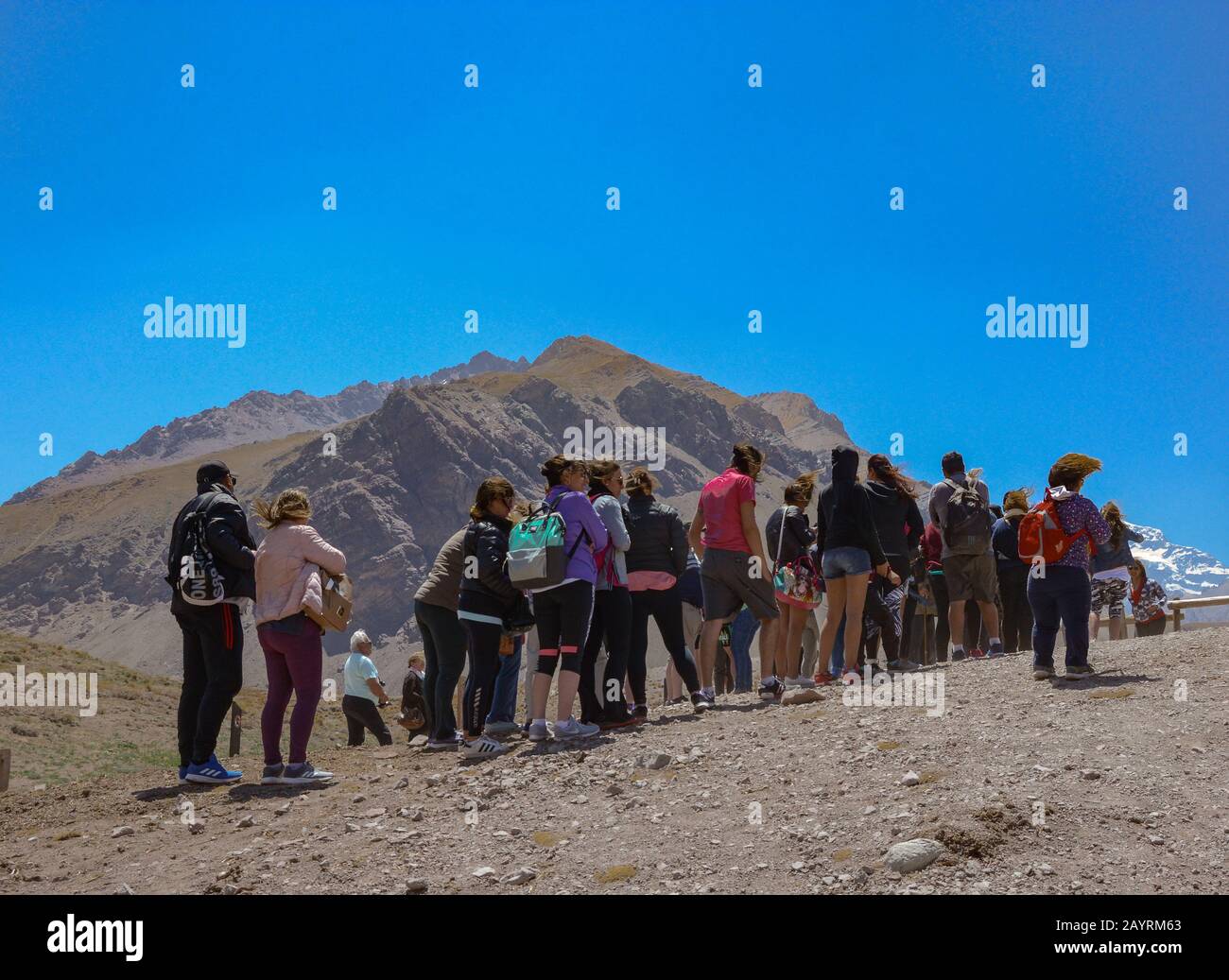 MENDOZA, ARGENTINA - NOVEMBER 17, 2019: Tourists queue to take a selfie photo in Aconcagua National Park in Mendoza, Argentina Stock Photo