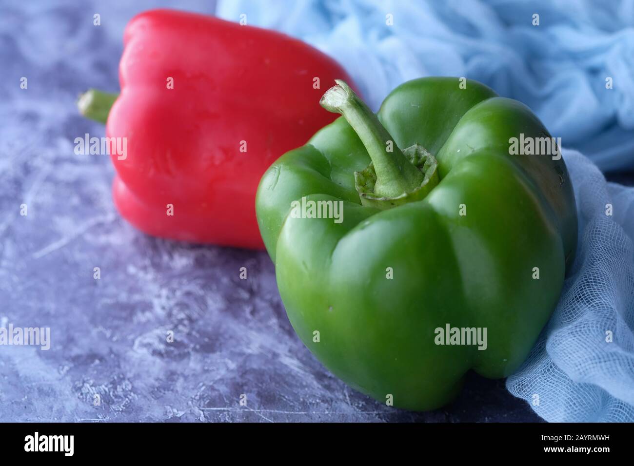 Close up of red and green capsicum on table  Stock Photo