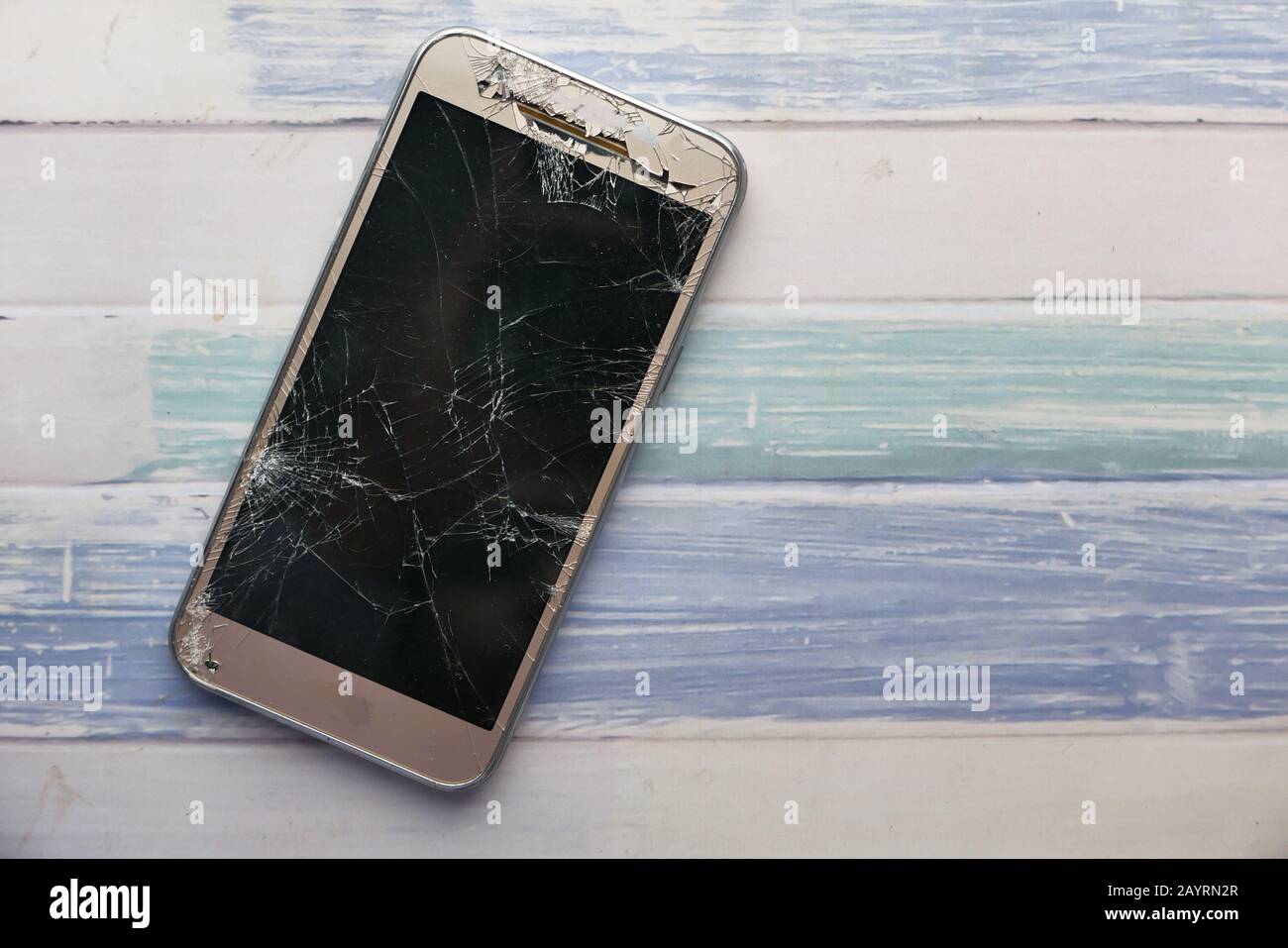 top view of broken smart phone on table  Stock Photo