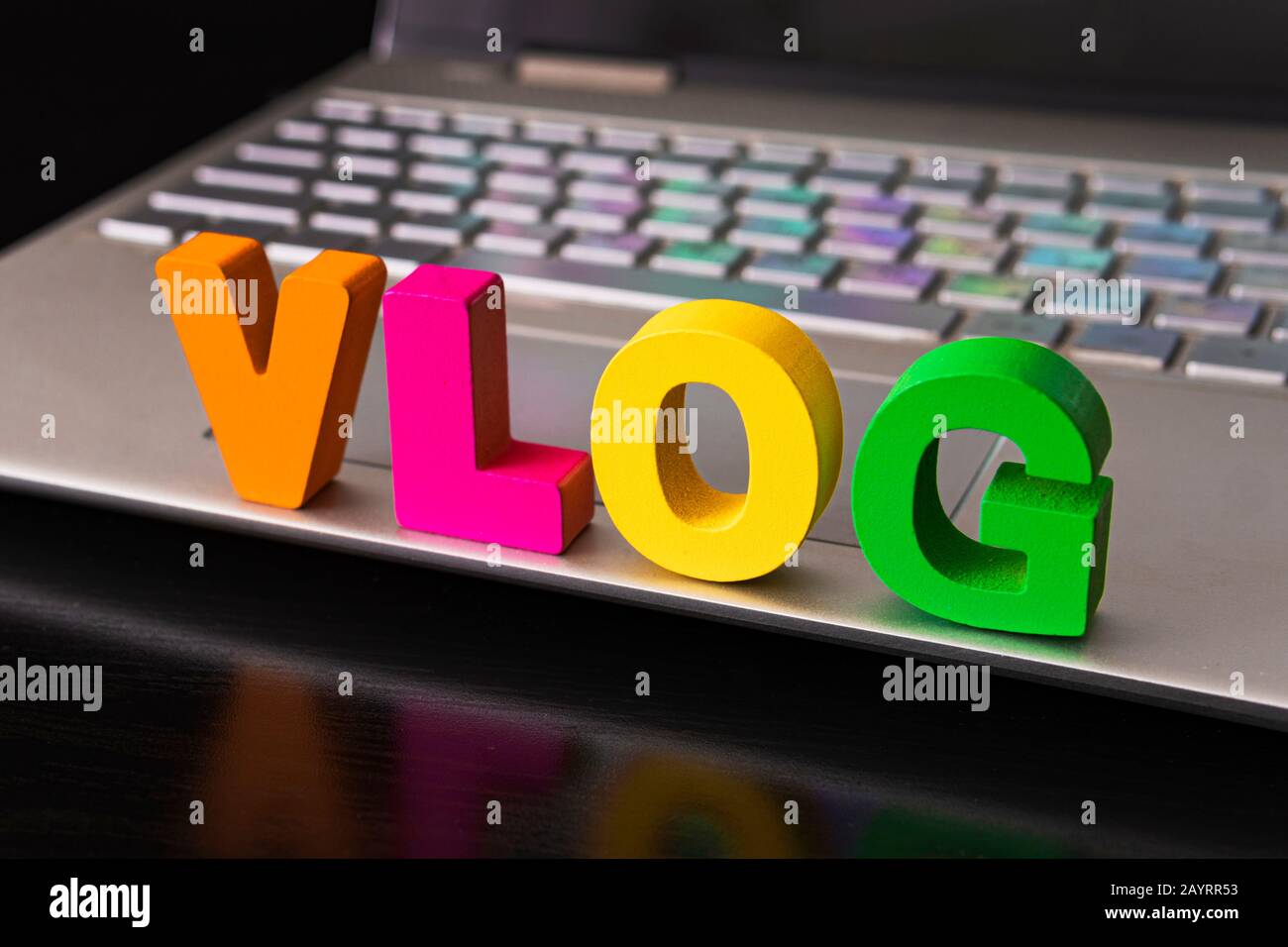 Vlog or video blog concept with vlog word from funny letters on