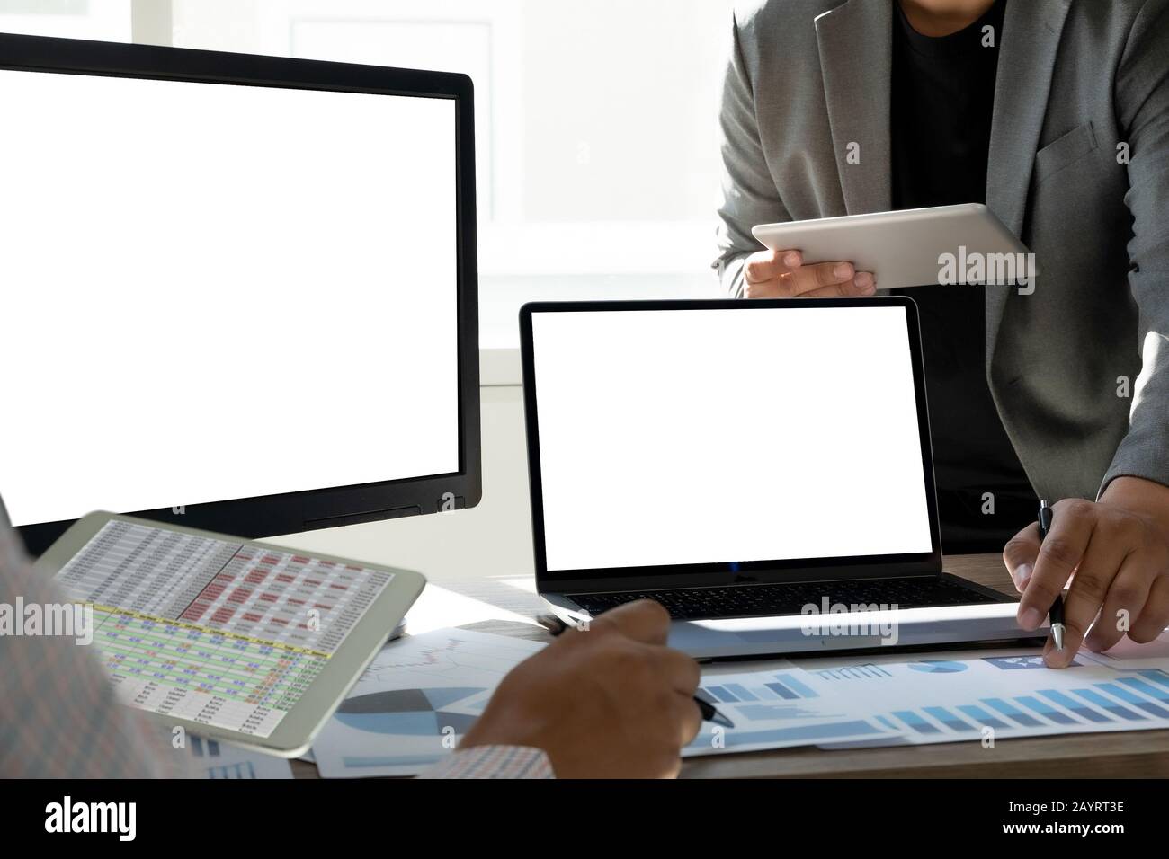 man Using laptop with blank screen work on Blank screen computer Cloud computing Stock Photo