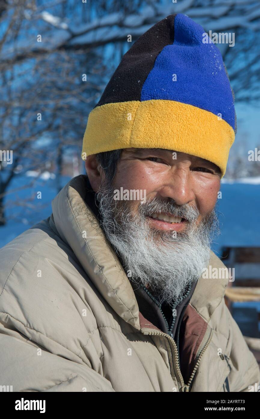 Portrait of a Japanese man offering horse sled rides at the Abashiri Okhotsk Ryuhyo Museum (Drift Ice Museum) on Mount Tento in Abashiri, a city on Ho Stock Photo