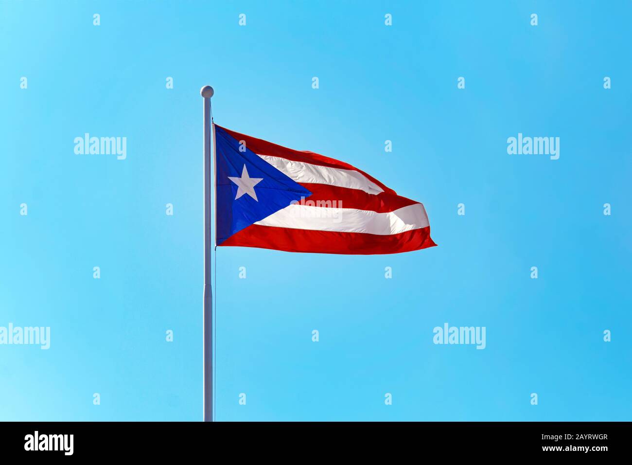 Beautiful Puerto Rican flag against a blue sky Stock Photo