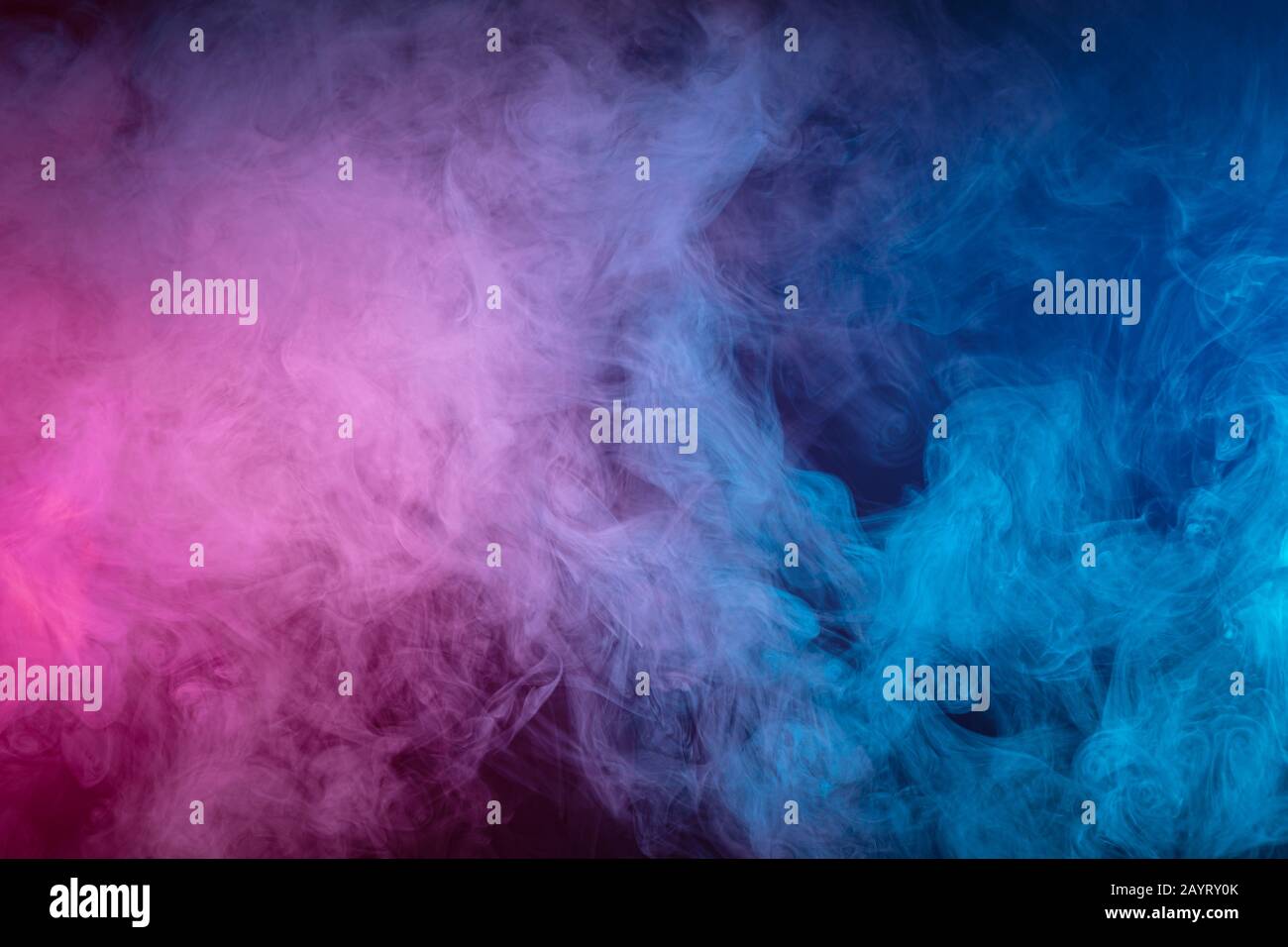 Blue and pink bomb smoke on black isolated background Stock Photo - Alamy