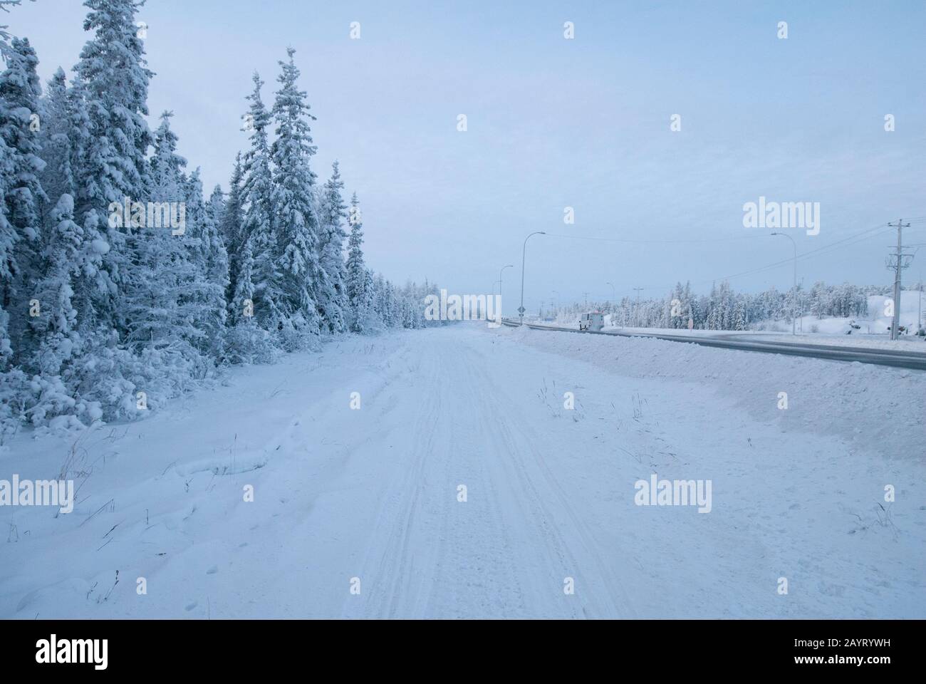 Winter scene by the side of the Yellowknife Highway, Northwest Territories, Canada Stock Photo