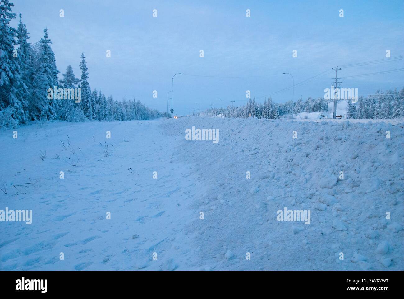Winter scene by the side of the Yellowknife Highway, Northwest Territories, Canada Stock Photo