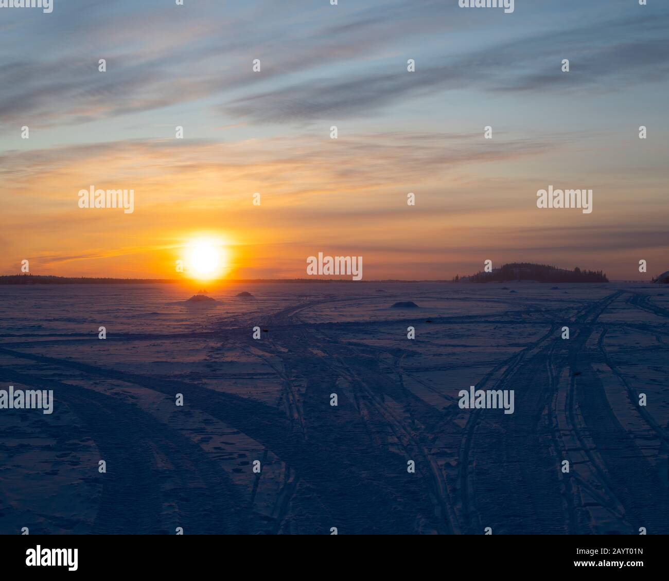 Morning sun over the Dettah ice road in Yellowknife, Northwest Territories, Canada Stock Photo