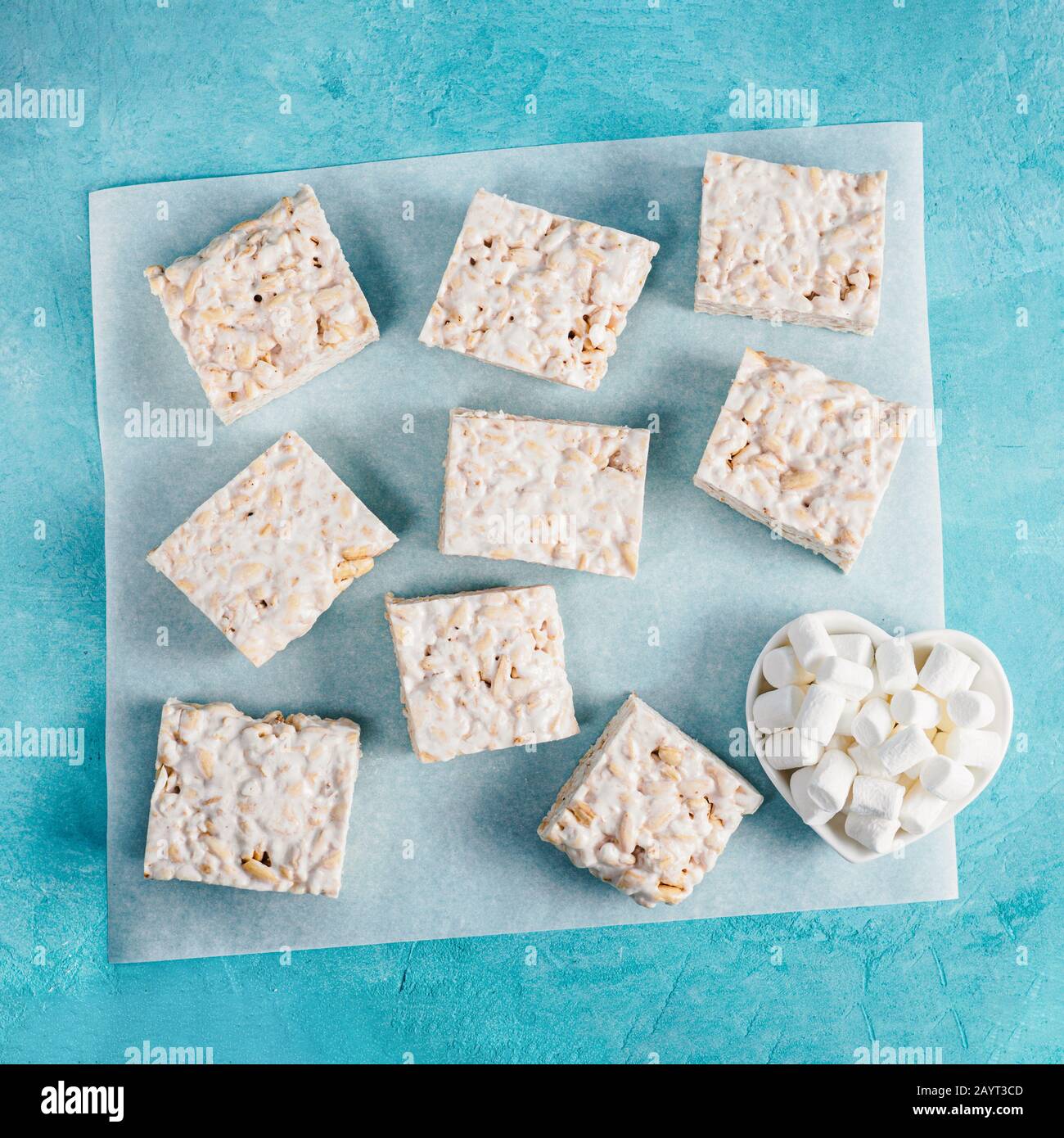 Homemade square bars of Marshmallow and crispy rice and ingredients on