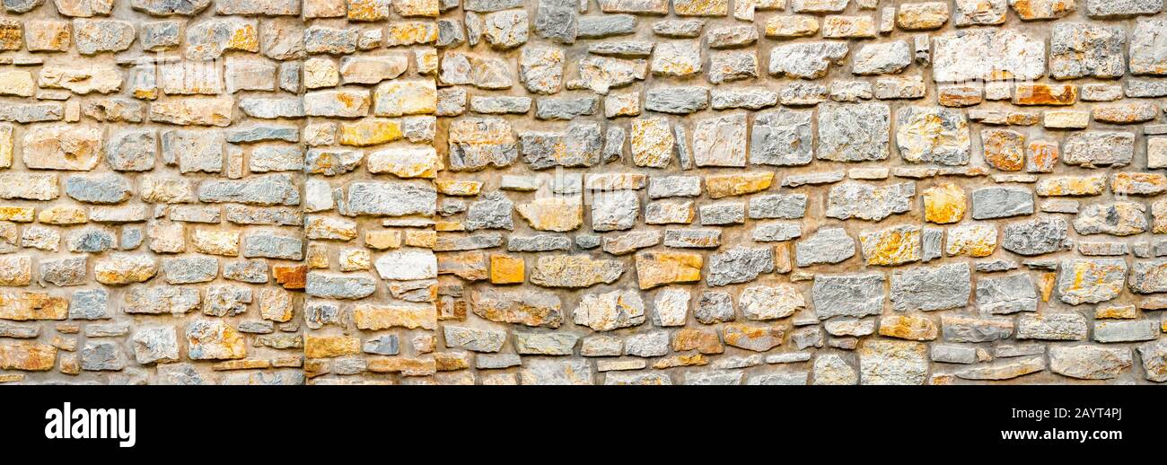 Stone wall banner, background. Wall pattern texture background. Surface  with asymmetrical stones. Old wall of ancient architecture. Rome, greek  culture, architecture. Fragment of historic building Stock Photo - Alamy