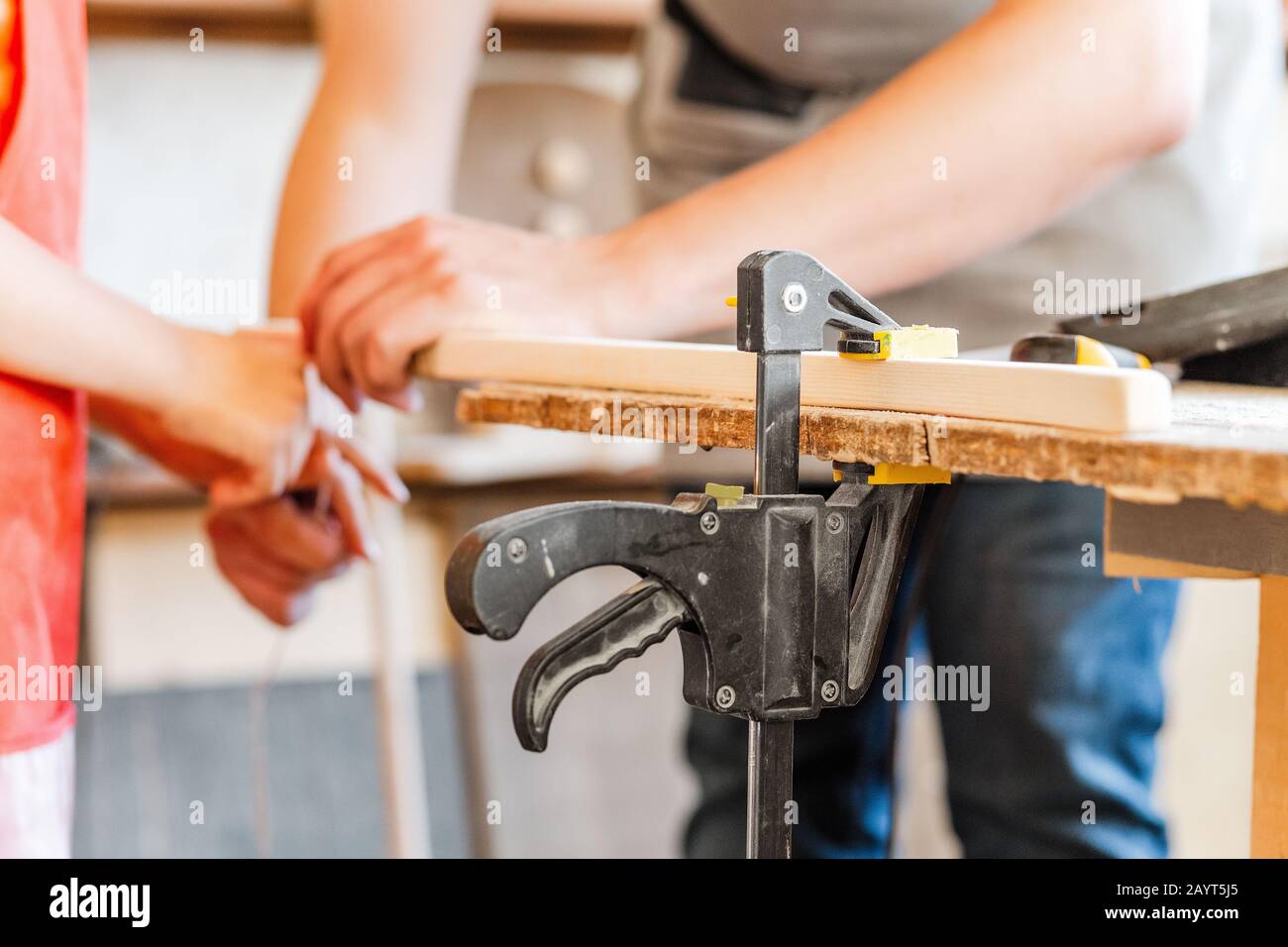 carpenter working with wood, close up on hands Stock Photo