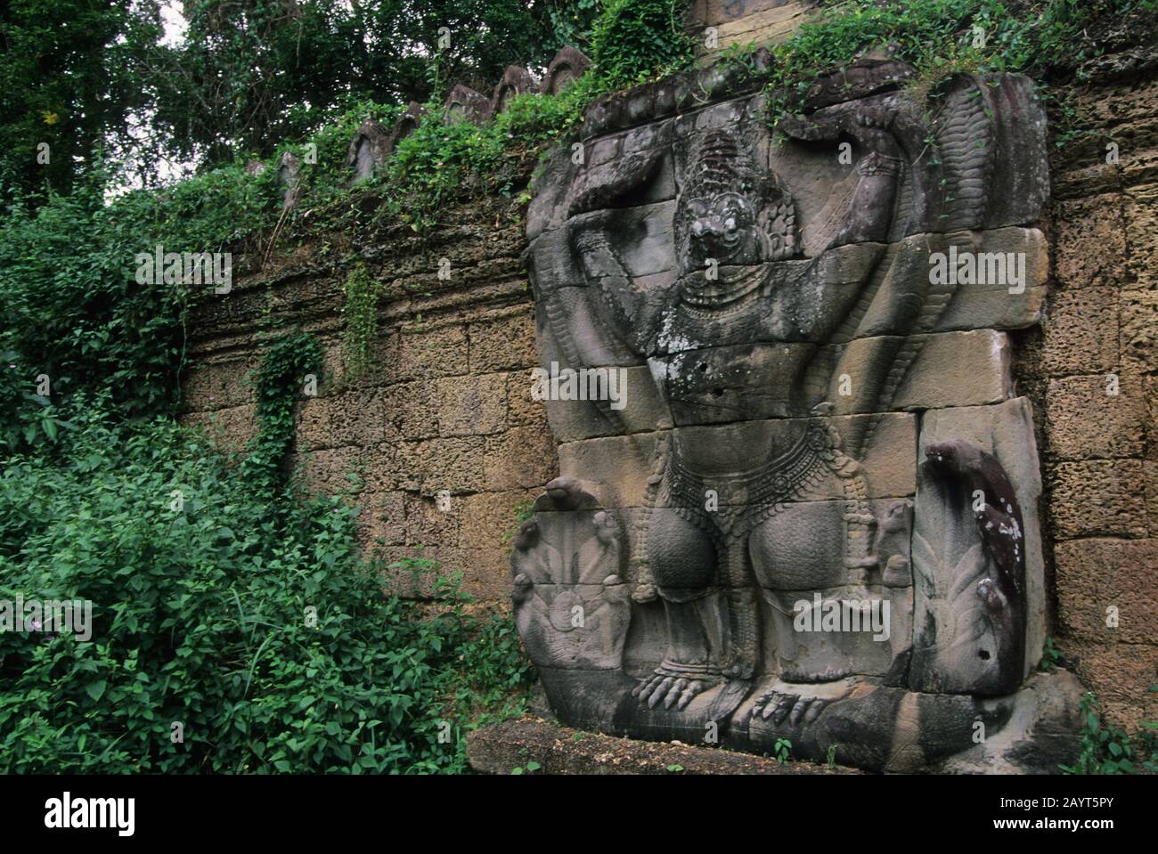 A stone carving of Garuda, a large mythical bird, bird-like creature, or humanoid bird that appears in both Hindu and Buddhist mythology at Preah Khan Stock Photo