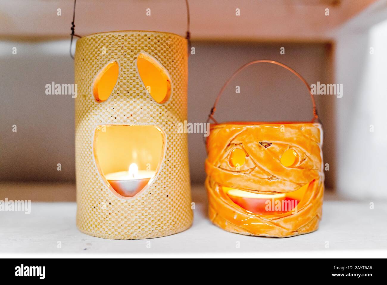 Halloween decorations with ceramic pumpkin and candlesticks Stock Photo
