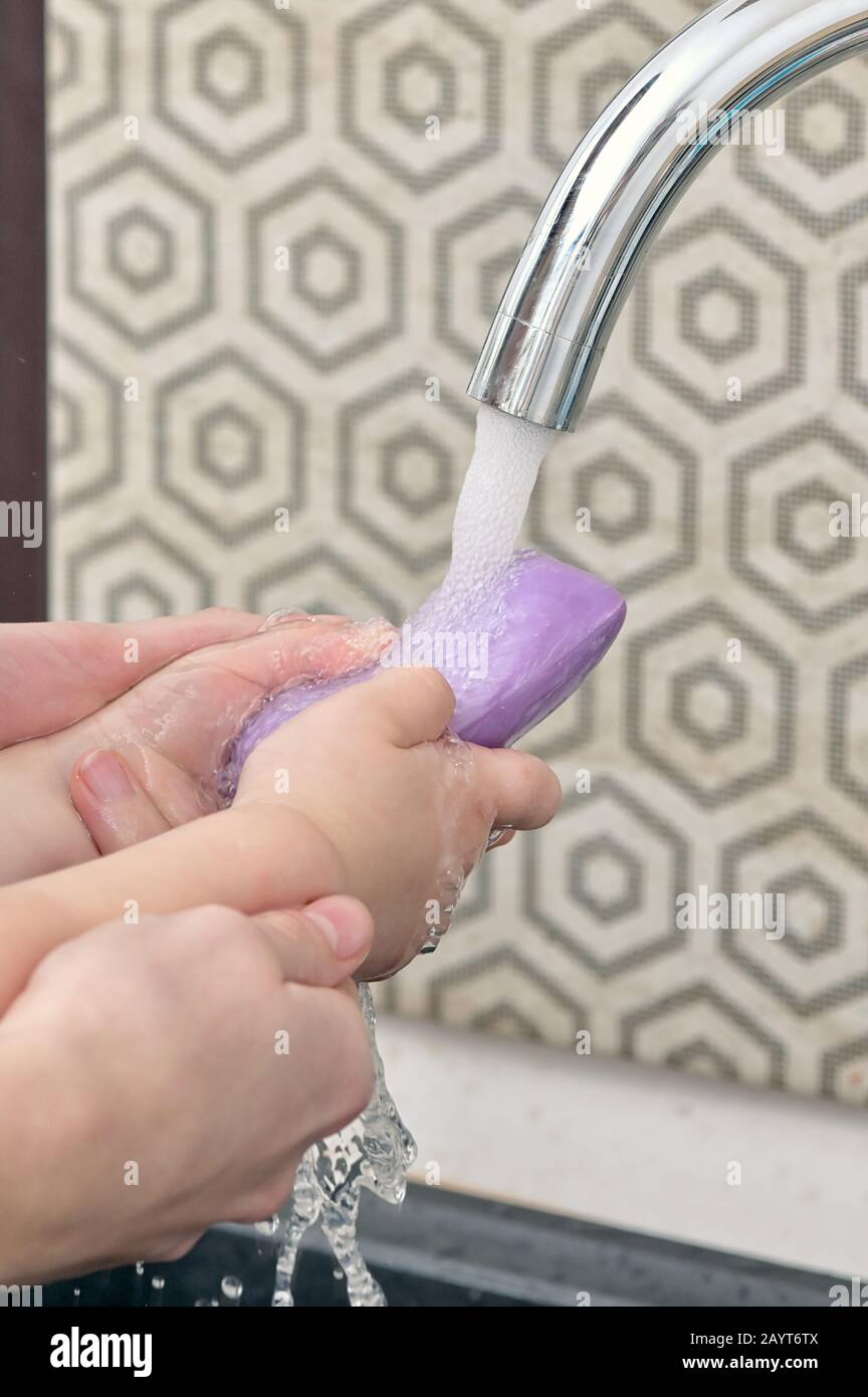 Mother And Kid Wash Hands With Soap Bar Stock Photo Alamy