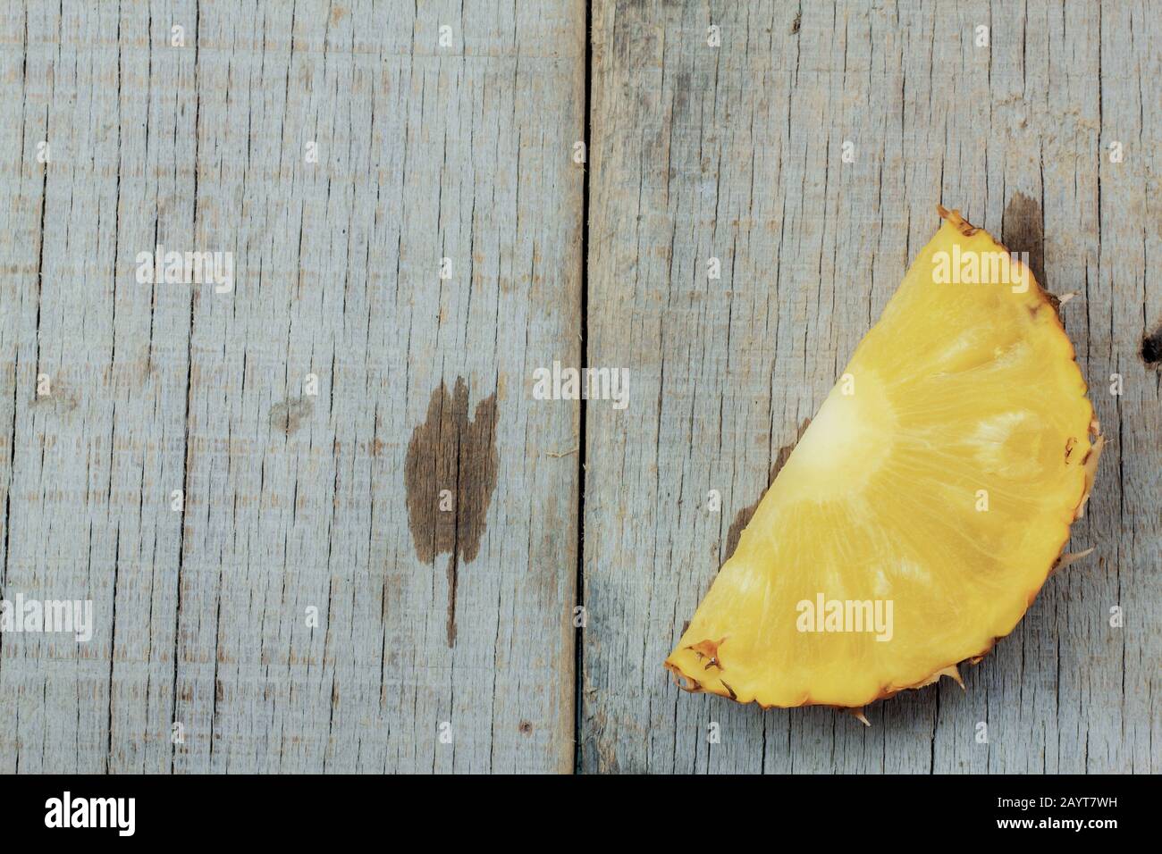 Ripe of pineapple sliced on a wooden. Stock Photo