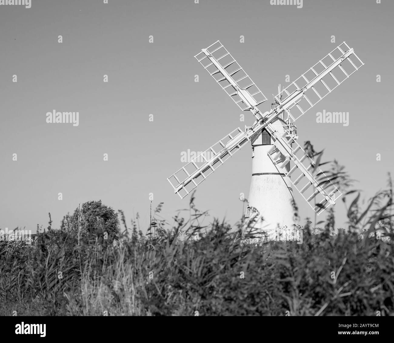 5 White windmill in the countryside on a bright and sunny day Stock Photo