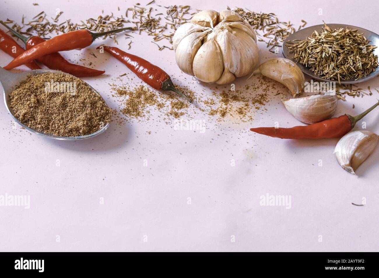 Flat layout of cooking seasoning against a pink background to show concept of gastronomy, cuisine, cooking and healthy diet Stock Photo