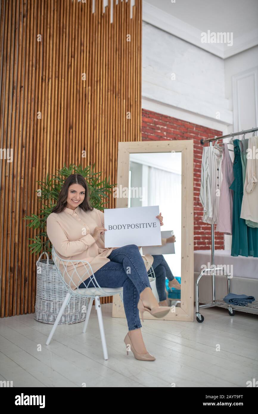 Pretty woman sitting legs crossed hi-res stock photography and images ...