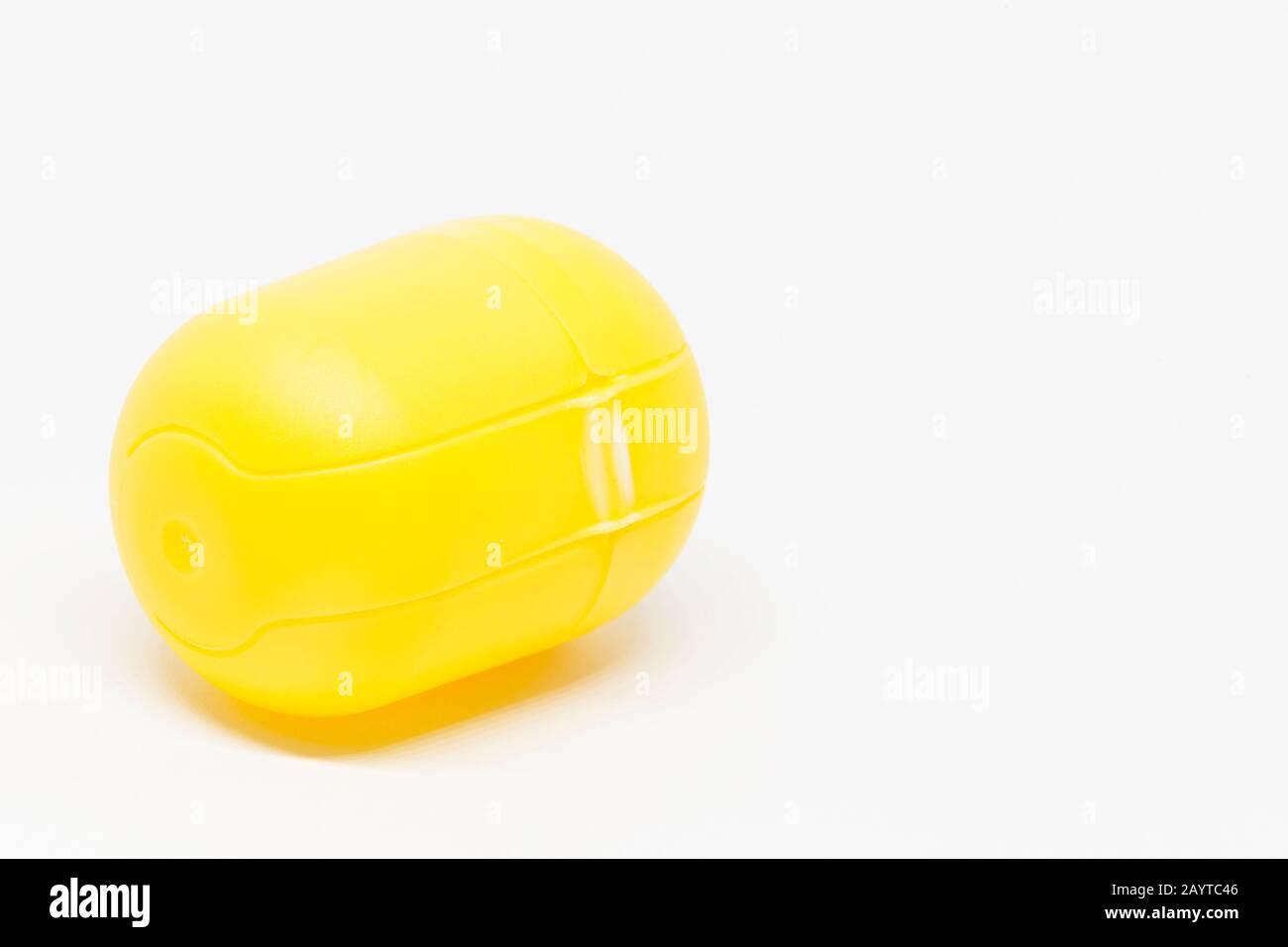 a yellow closed toy egg on white background Stock Photo