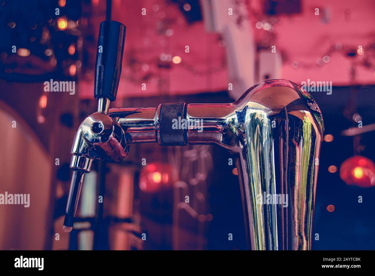 Tap of a draft beer machine shot in rose gold color tone to create a 1920's inspired look and theme Stock Photo
