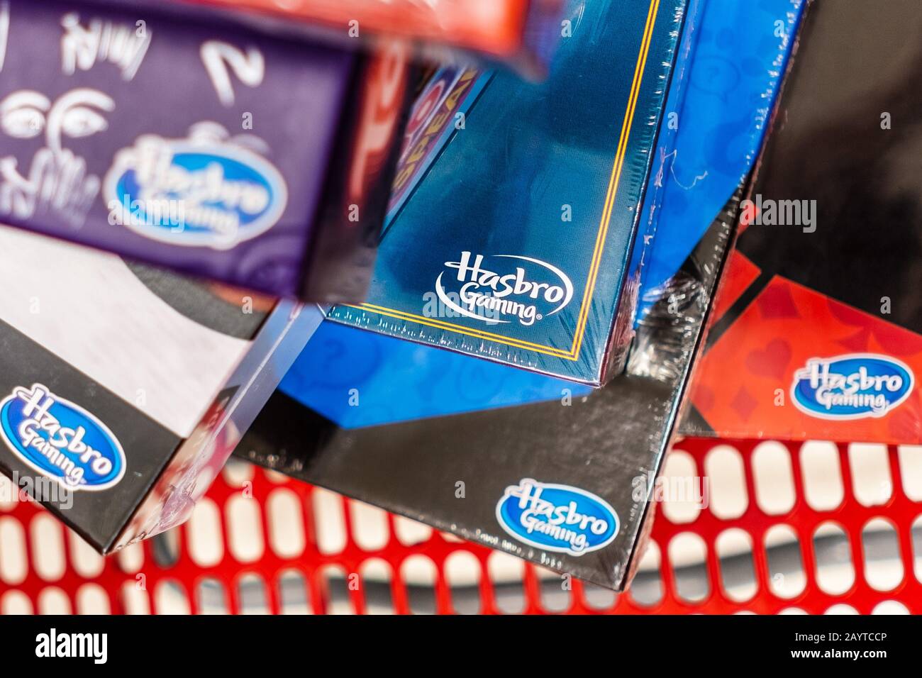 Feb 10, 2020 Sunnyvale / CA / USA - Hasbro Gaming logos visible on several Game boxes stacked in a shopping cart; Hasbro Inc is an American worldwide Stock Photo