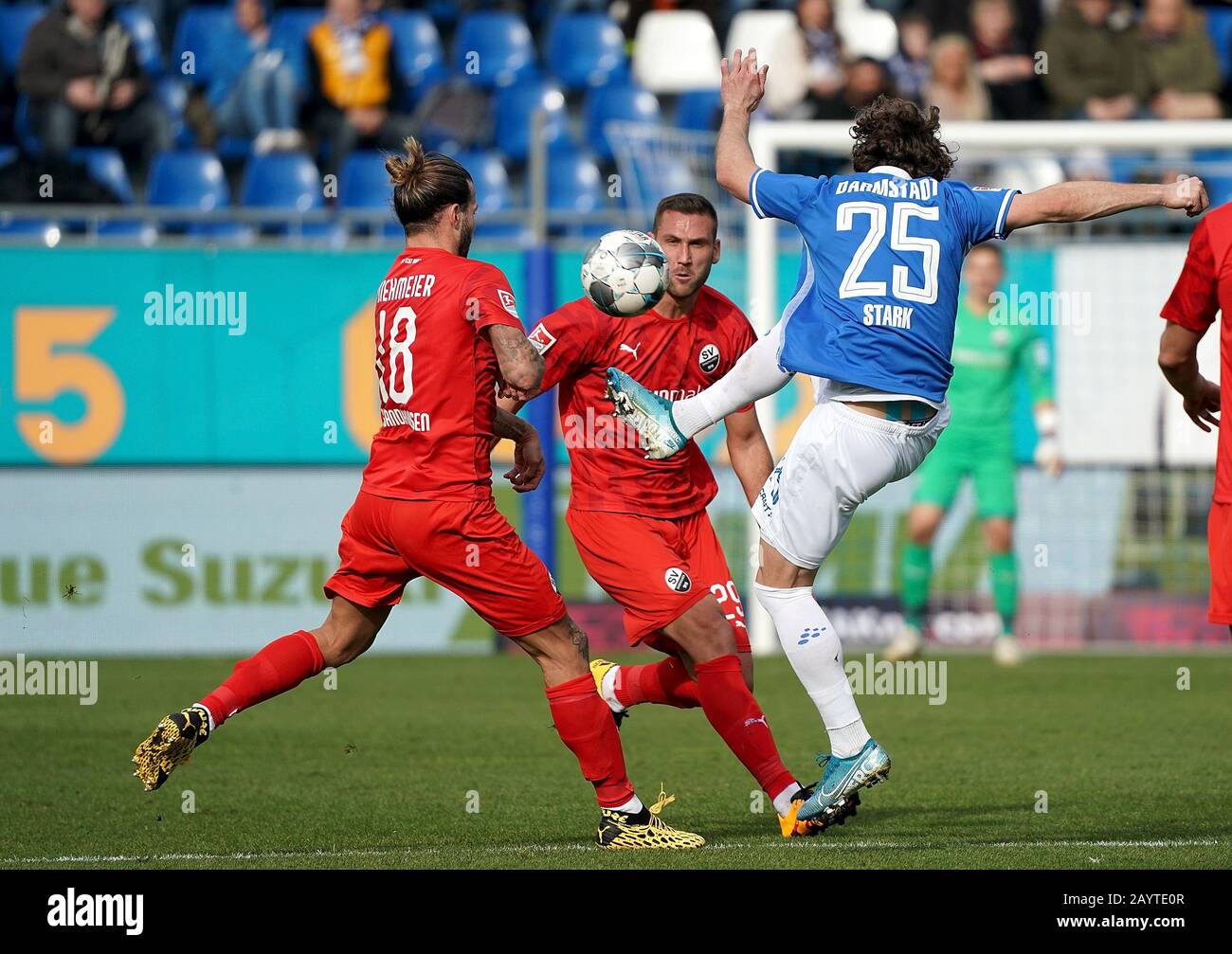 Darmstadt, Germany. 16th Feb, 2020. Football: 2nd Bundesliga, Darmstadt 98 - SV Sandhausen, 22nd matchday Darmstadt's Yannik Stark (R) in a duel with Dennis Diekmeier (L) and Ivan Paurevic (M) from Sandhausen. Credit: Hasan Bratic/dpa - IMPORTANT NOTE: In accordance with the regulations of the DFL Deutsche Fußball Liga and the DFB Deutscher Fußball-Bund, it is prohibited to exploit or have exploited in the stadium and/or from the game taken photographs in the form of sequence images and/or video-like photo series./dpa/Alamy Live News Stock Photo