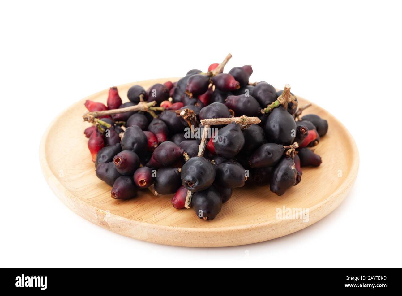 Syzygium cumini, black plum, jamun or Syzygium cumini in wooden plate isolated on white background with clipping path Stock Photo